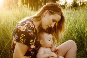 Mom and baby in grass