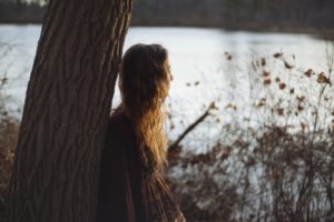 Woman by lake