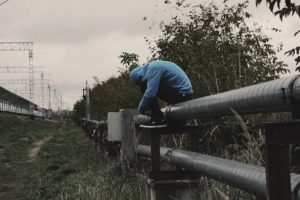 Sad man on fence thinking about SAMHSA 