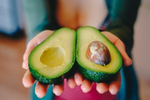 Woman with avacado