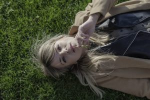 Woman laying in grass