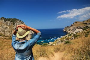 Girl looking at beach and overcoming health risks of addiction