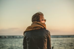 Woman at the beach struggling with a relapse of drug addiction