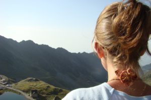 Woman on a cliff practicing Self-regulation