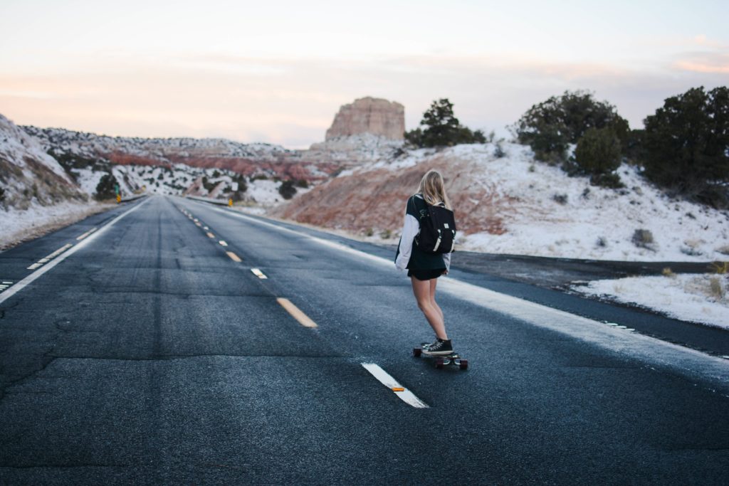 Teen skate boarding