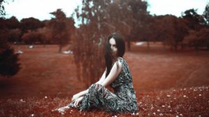 Woman sitting in the grass