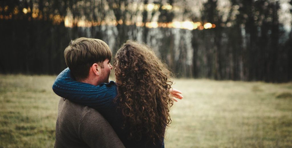 Couple hugging.