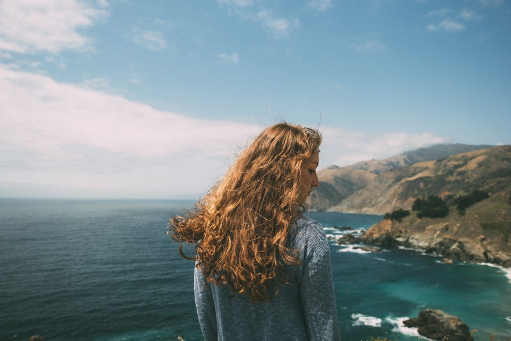 Girl by the ocean struggling with opioid addiction