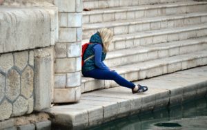 Woman on the stairs struggling with Female Sex Addiction