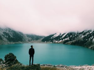 Man looking at a lake