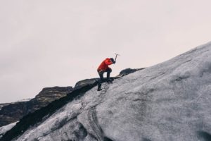 Man climbing a mountain