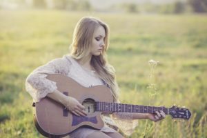 College girl playing guitar