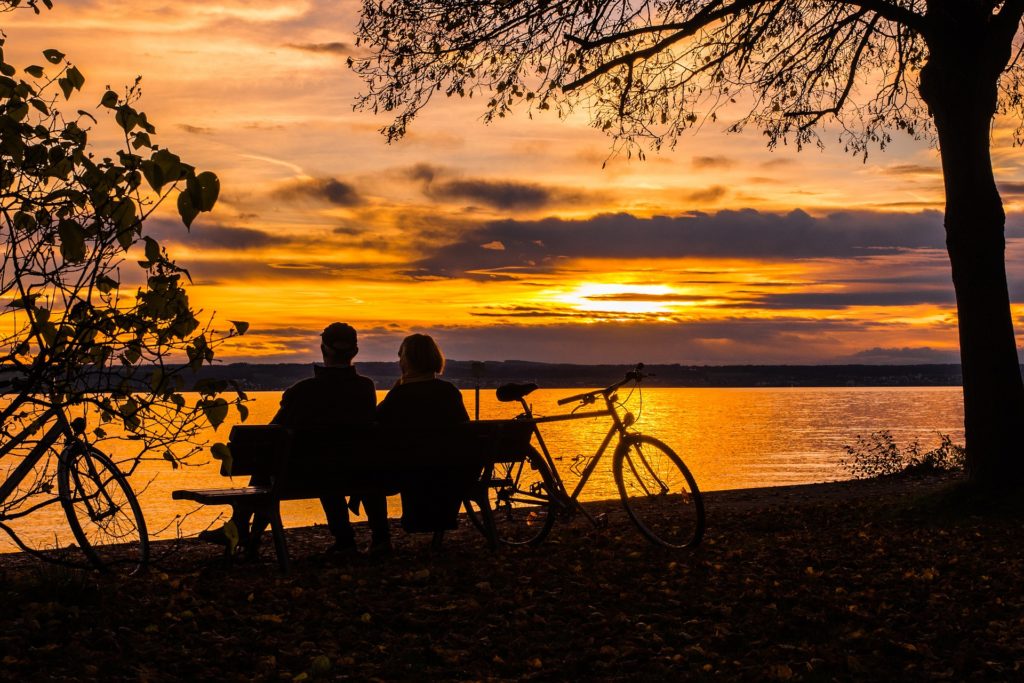 Couple in sunset discussing sex addiction rehab