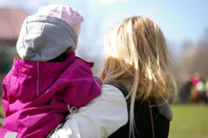 Mom holding child