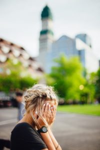 Woman hiding face