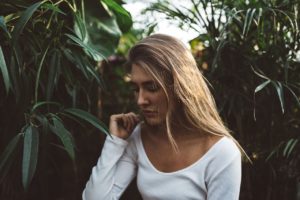 Woman walking through the trees