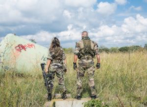 Soldiers walking in the grass