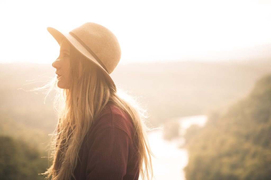 Woman in hat struggling with co-occurring addictions