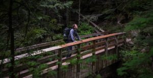 Man standing on a bridge