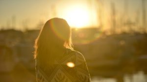 Woman sitting watching the sunset