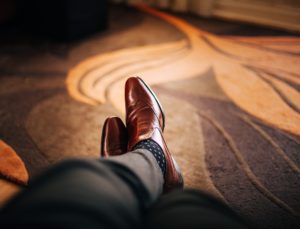 Man sitting on the floor struggling with Compulsive Sexual Behavior