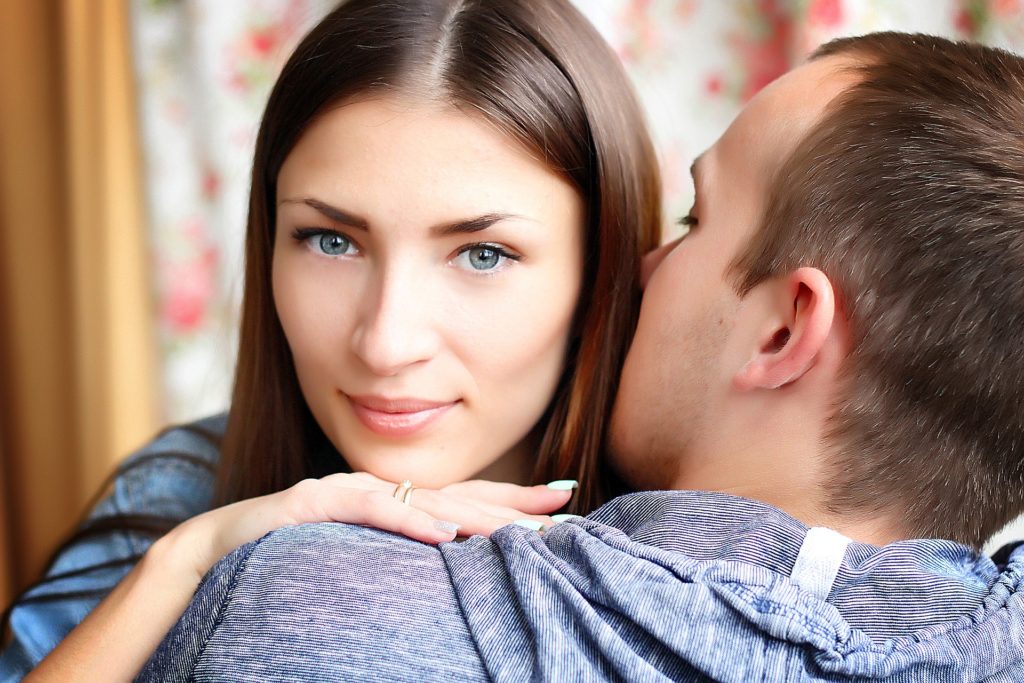 woman hugging her boy friend after losing her job