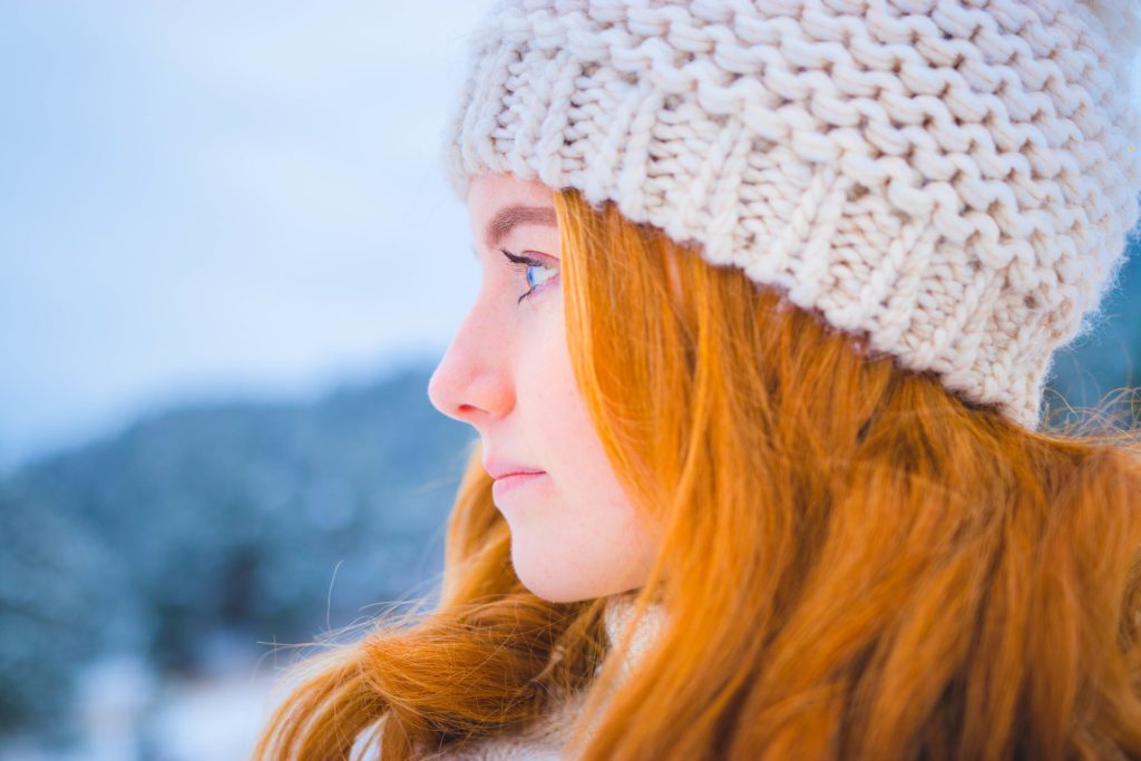 Woman in hat struggling with Mixing Cold Medications with Prescription Drugs