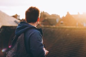 Man looking at sober living house