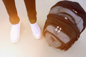 Teen standing with backpack