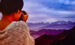 Woman taking photos during her travel