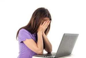 Girl with her head in her hands