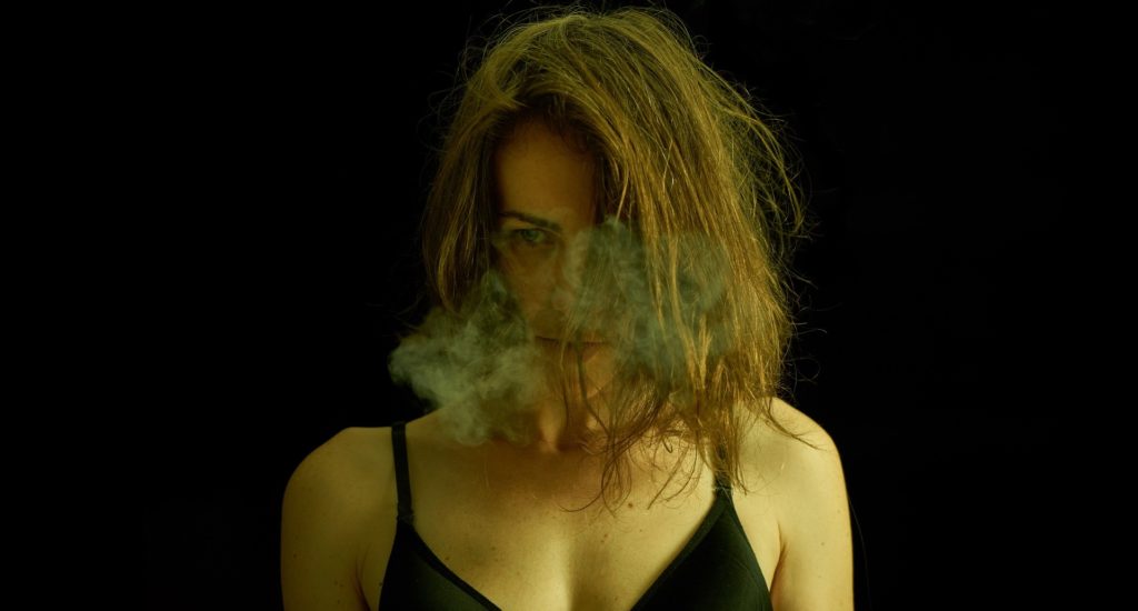 Lady Smoking Marijuana and helping the Cannabis Market