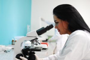 Doctor with Research Microscope