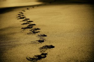 Footsteps in the sand in Dry January