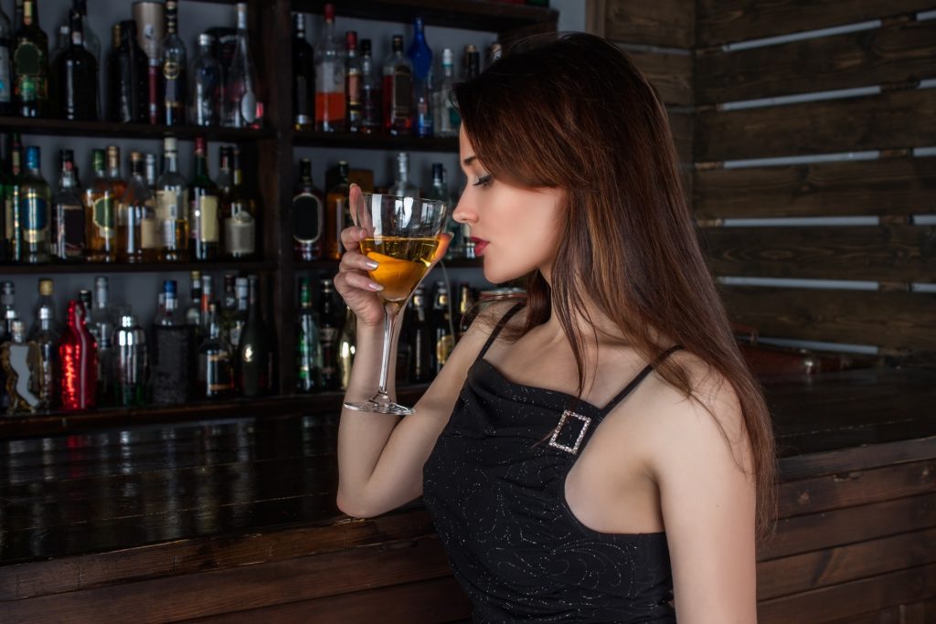 Woman Drinking Martini at Bar