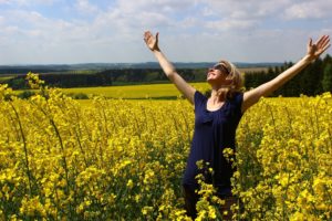 Girl on yellow field using Vivitrol to bead OUD