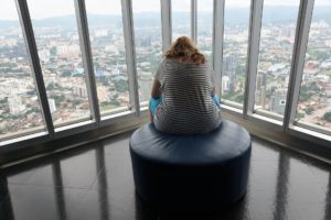 Lady sitting alone dealing with anxiety 