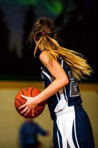 Female Athletes playing basketball