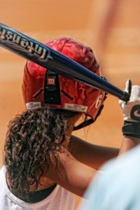 Female athletes playing softball