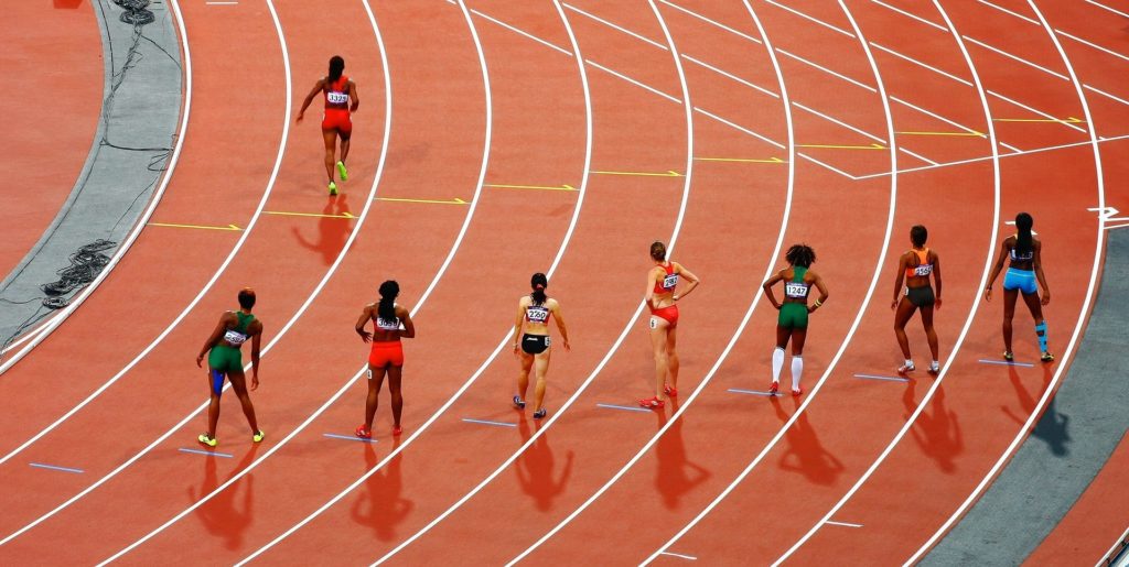 Women Athletes on Running Race Track